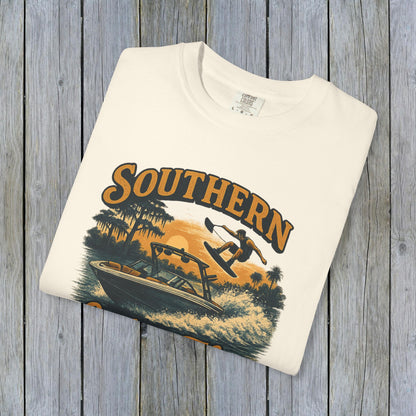 Folded Southern Lake Flow T-Shirt in cream color, crafted from 100% US cotton. A stylish and sustainable choice for outdoor enthusiasts.