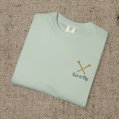 Folded Tee It High Let It Fly Graphic Tee in light green, showcasing the stylish design with 'Let It Fly' text and crossed golf clubs on the chest.