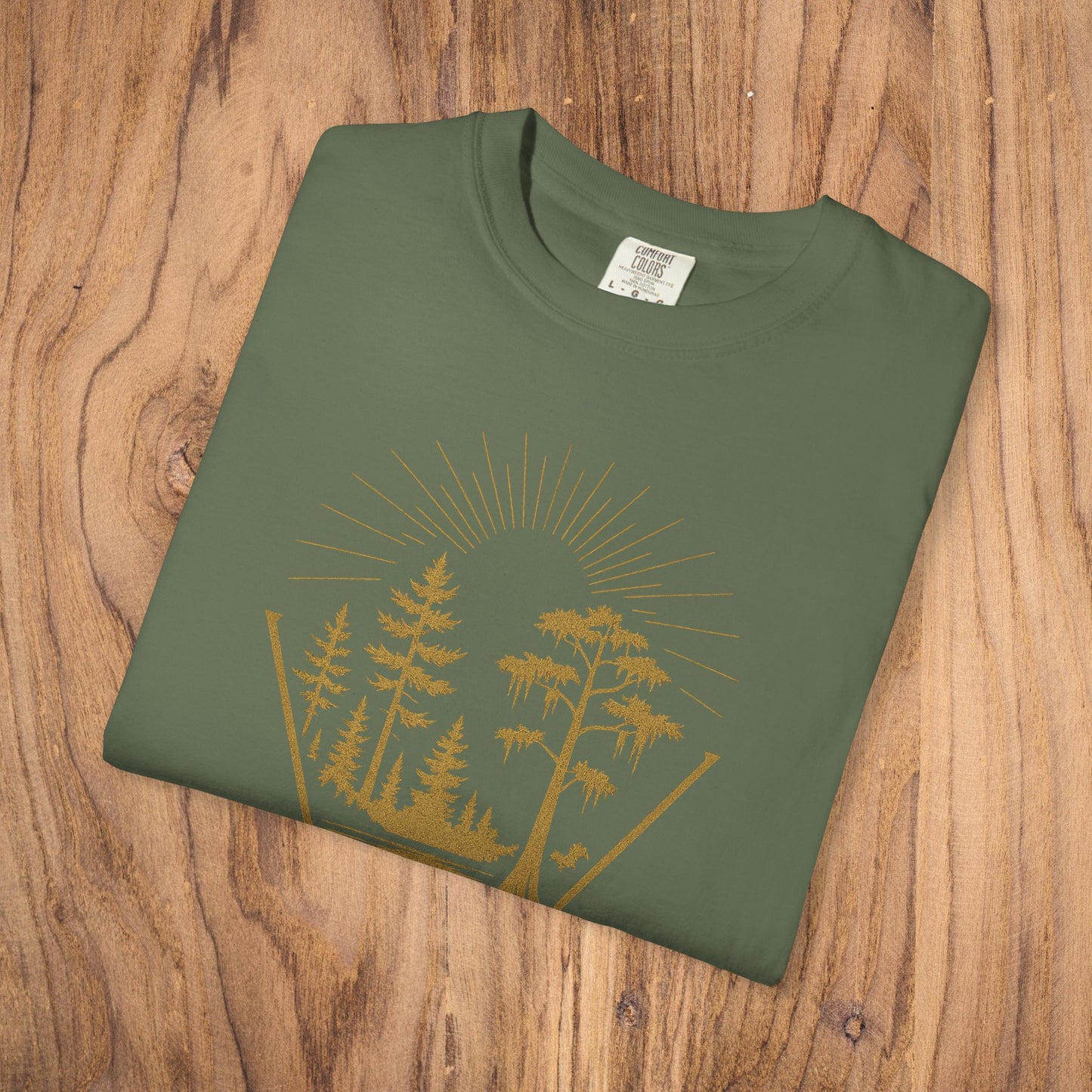 Nature Outdoor Vibes Tee - Soft 100% US Cotton, featuring an olive green fold with a nature graphic on a wooden surface.