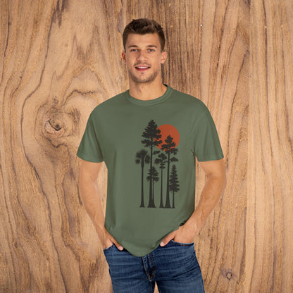 Sunset Trees Unisex T-Shirt model posing in olive green featuring a beautiful tree silhouette and sunset, great for outdoor enthusiasts.