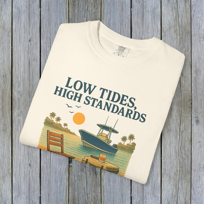 Garment-Dyed Low Tides High Standards T-Shirt in cream displaying a scenic boat and sunset illustration, perfectly blending comfort with a stylish look.