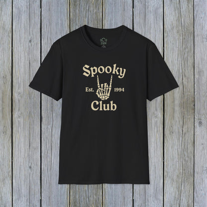 Unisex Spooky Club Tee displayed on a rustic wooden background, featuring a skeleton hand graphic and the text 'Spooky Club Est. 1994' in a stylish font. Durable design crafted from 100% soft cotton, perfect for Halloween enthusiasts.