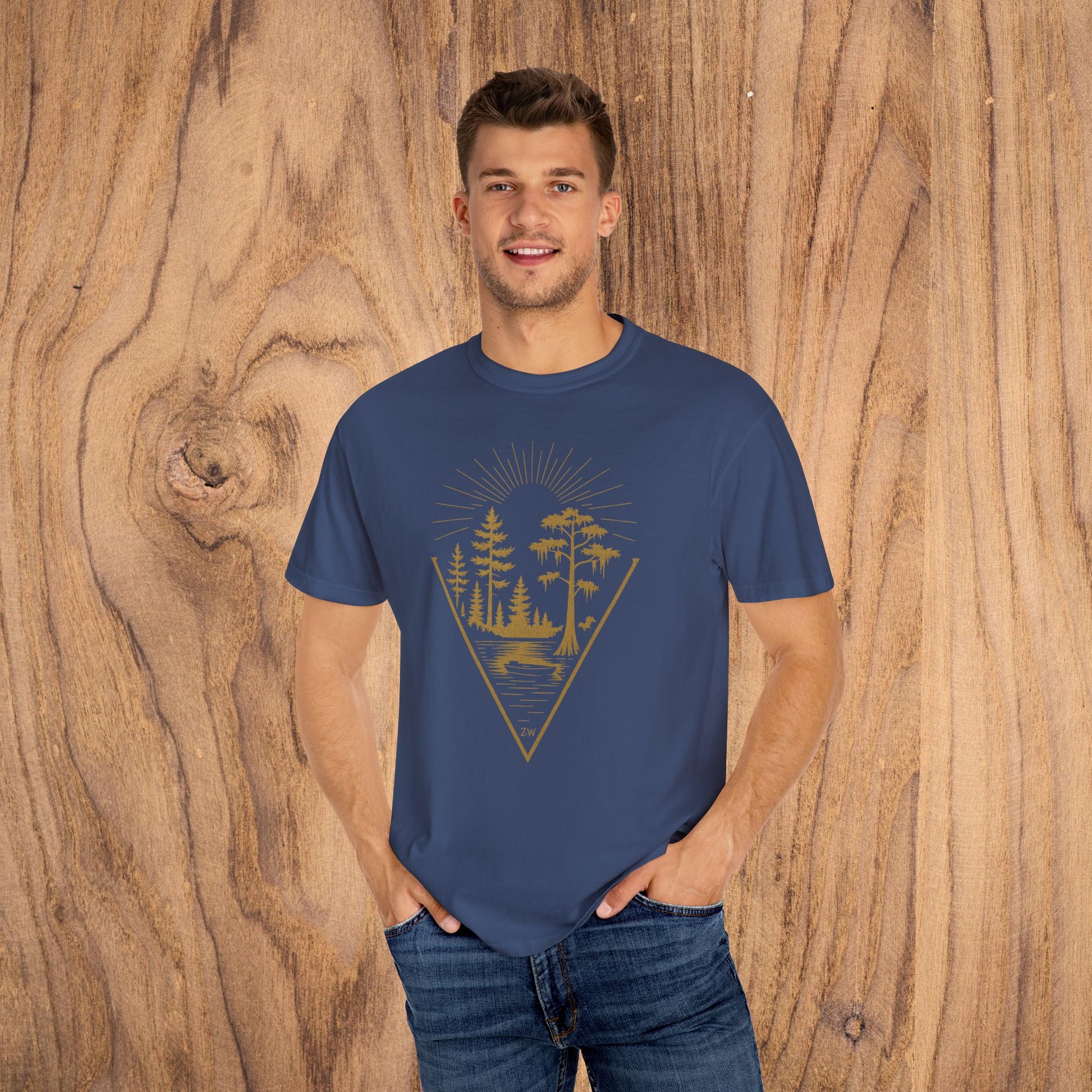 Nature Outdoor Vibes Tee - Soft 100% US Cotton, model displaying a navy T-shirt with a stylish forest print, great for adding flair to your outdoor wardrobe.