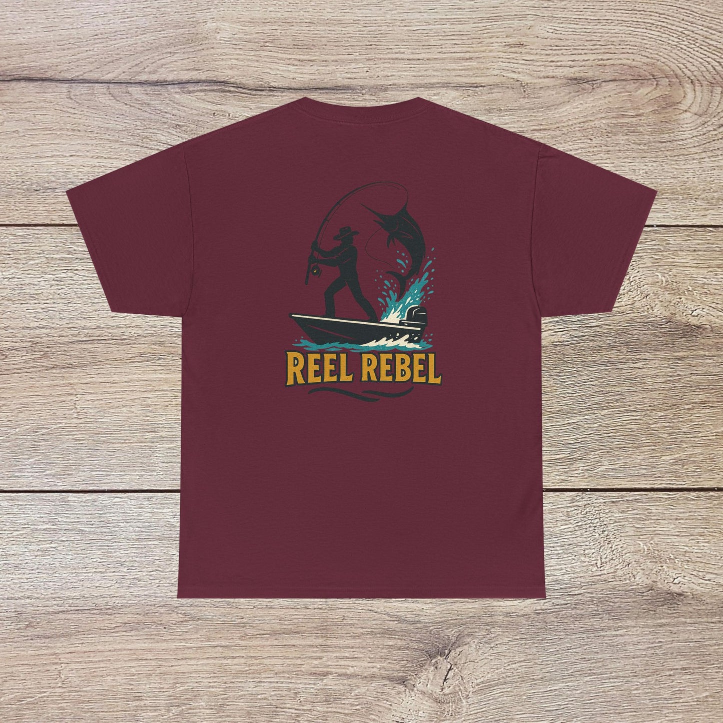 Fishing Adventure Tee in maroon color displaying 'REEL REBEL' theme. Versatile unisex heavy cotton shirt perfect for fishing enthusiasts and casual wear.