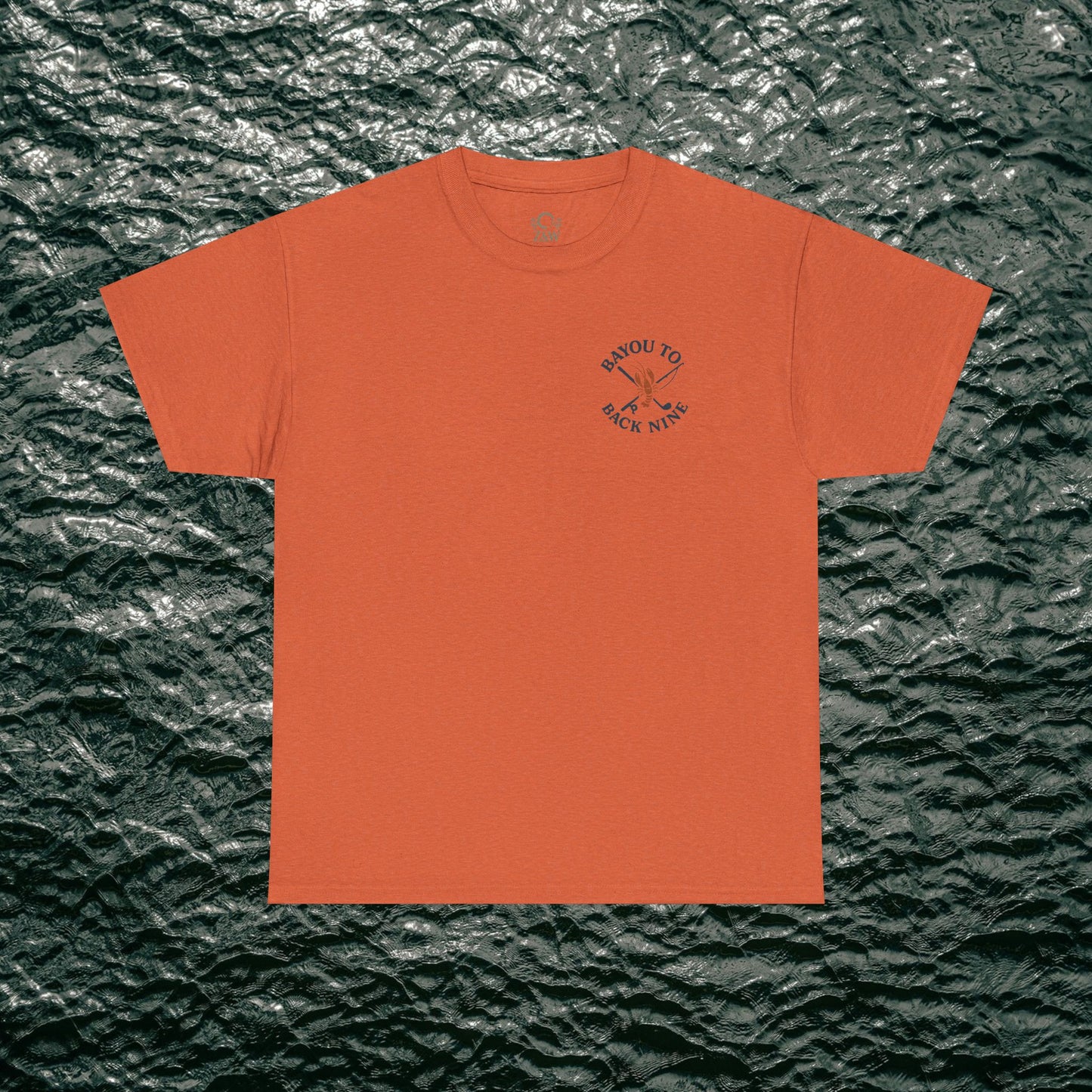 Bayou To Back Nine Softstyle Golf Tee in warm orange hue, designed for comfort and style, ideal for casual outings and leisure time.