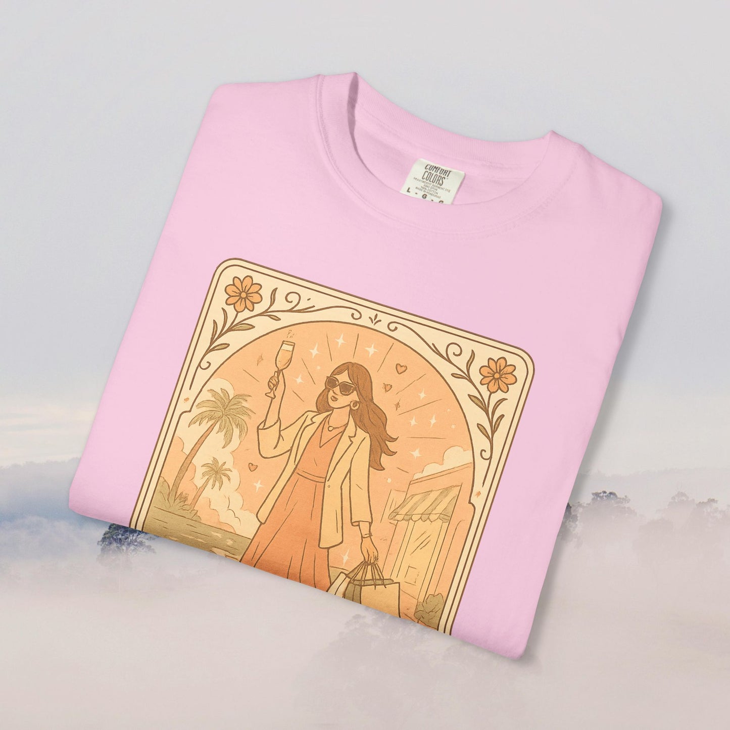 Brunch Babe Tarot Graphic Tee in soft pink, featuring a stylish woman holding a drink, perfect for casual occasions, made from 100% cotton.