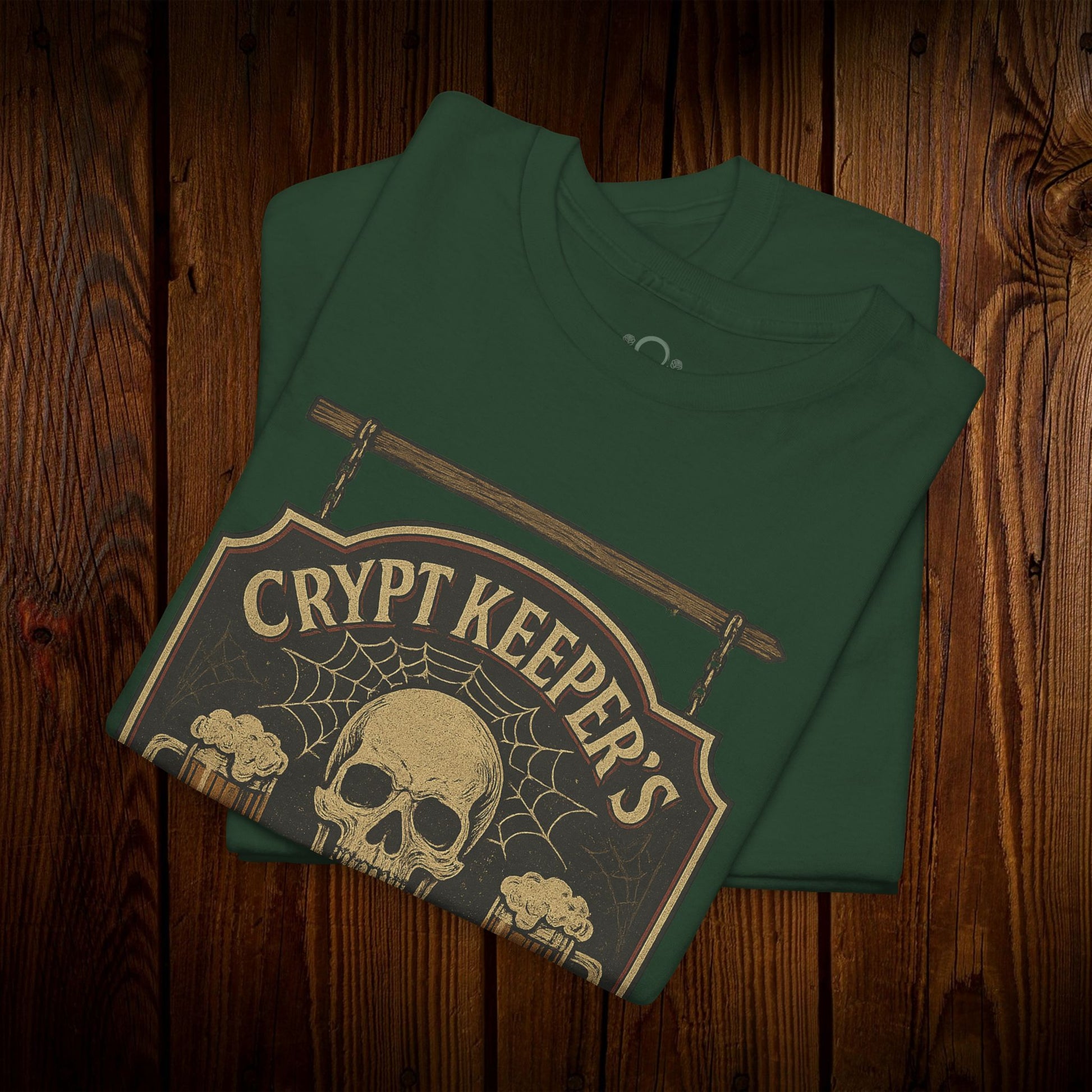 Close-up of Crypt Keeper's Pub Tee in dark green, featuring a detailed skull design with beer mugs, perfect for festive occasions and everyday wear.