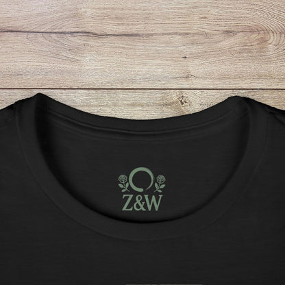 Women's Festival Crop Top in black featuring scoop neckline and Z&W logo, combining comfort and style for yoga enthusiasts.