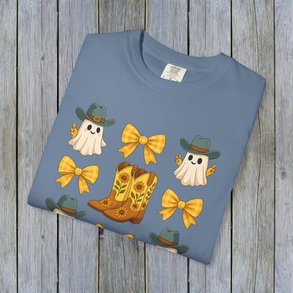 Folded Cute Halloween T-Shirt in blue with charming ghosts and cowboy boots design, made from eco-friendly fabric, perfect for trendy fall fashion.