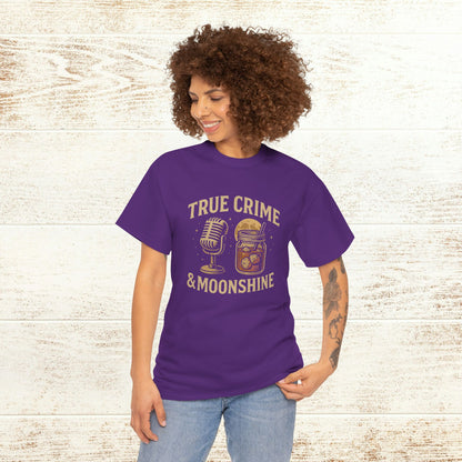 Model wearing True Crime & Moonshine Unisex Graphic Tee in purple, showcasing a unique vintage design for true crime lovers.