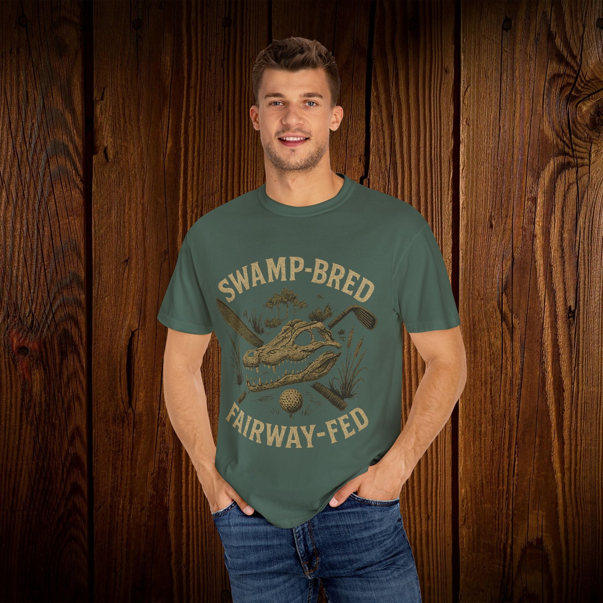 Model wearing the Unisex Swamp-Bred Fairway-Fed Tee in earthy green, featuring a unique graphic design that highlights the golf theme, providing a comfortable fit.