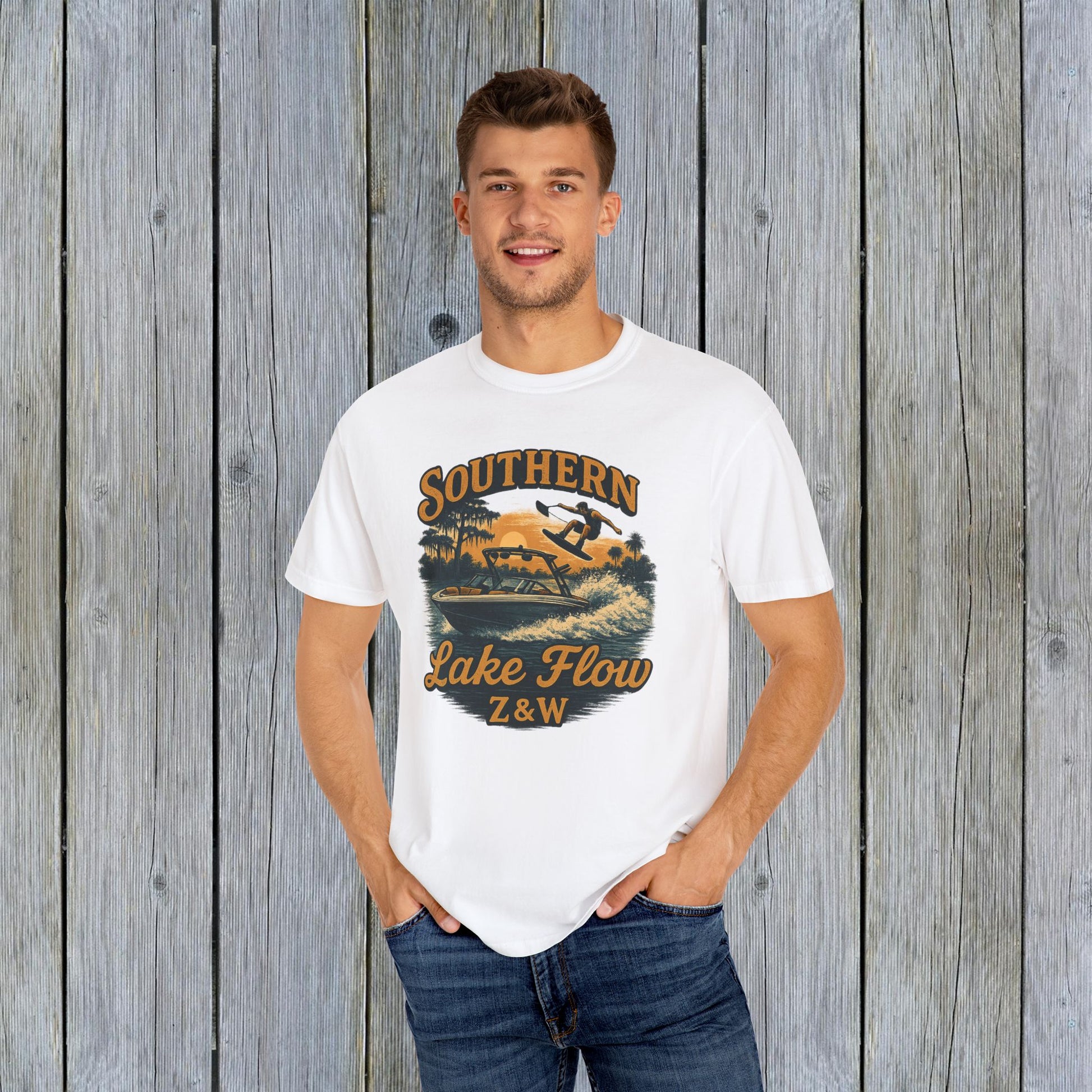 Model wearing the Southern Lake Flow T-Shirt in white, featuring a vibrant graphic of a wakeboarder, perfect for casual summer wear and eco-conscious fashion lovers.