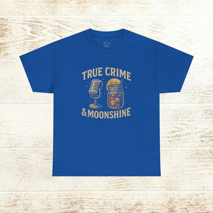True Crime & Moonshine Unisex Graphic Tee - Vintage Casual Wear for True Crime Lovers displaying a vibrant design of a microphone and moonshine jar on a blue fabric.