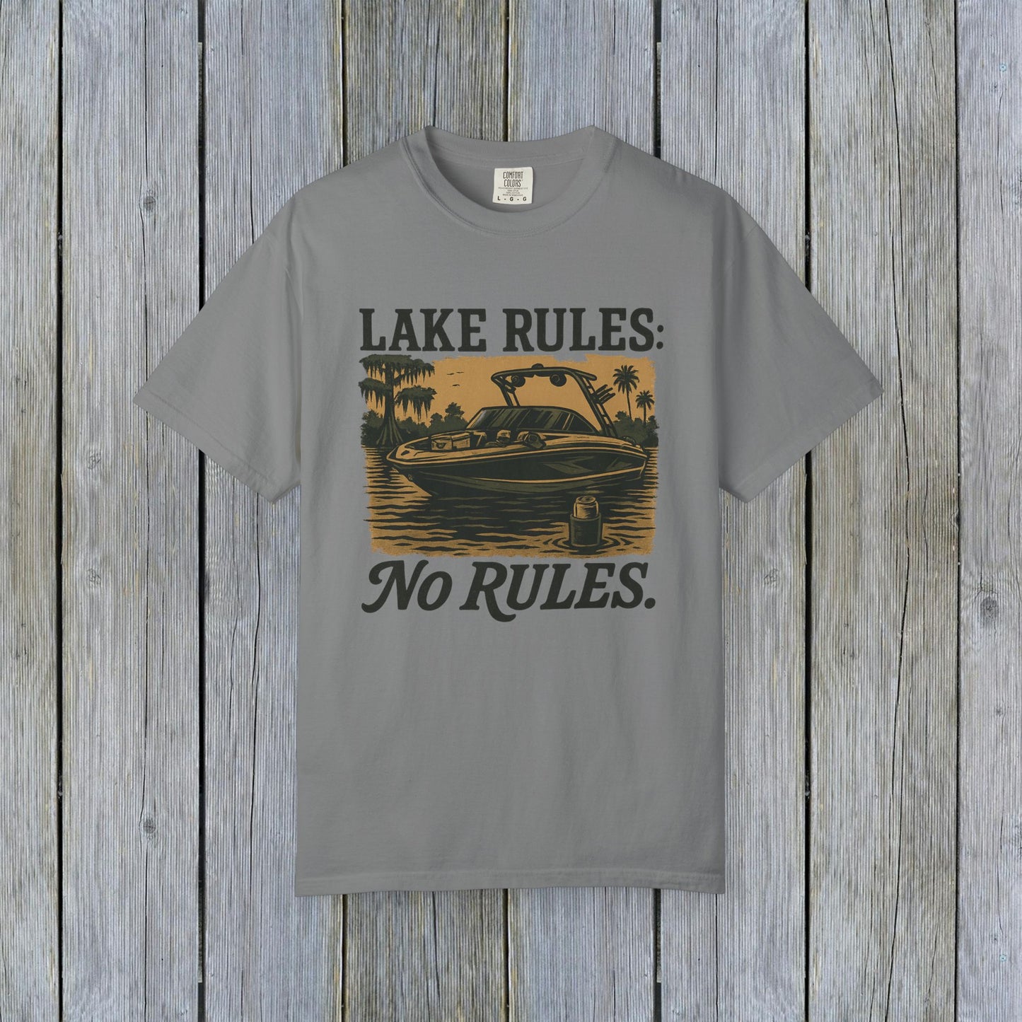 Gray Unisex Garment-Dyed Lake Rules Tee with a rustic boating design and the phrase 'Lake Rules: No Rules.' Great for lake lovers and casual wear.