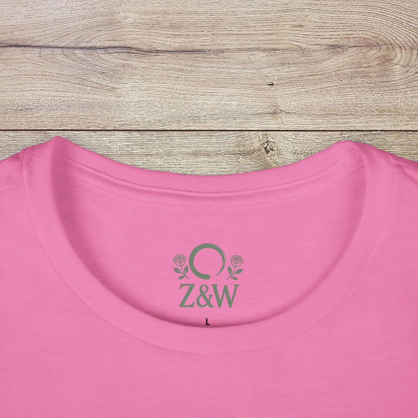 Close-up of the pink Mamacita Margarita Cotton Tee with a ribbed collar, showcasing its ethically sourced fabric and durability.