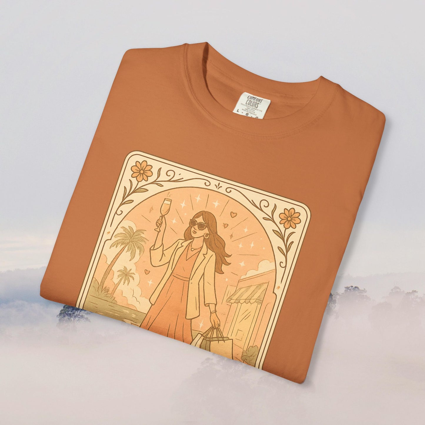 Brunch Babe Tarot Graphic Tee in earthy orange, showcasing a fashionable woman with a drink, ideal for relaxed style, crafted from 100% cotton.