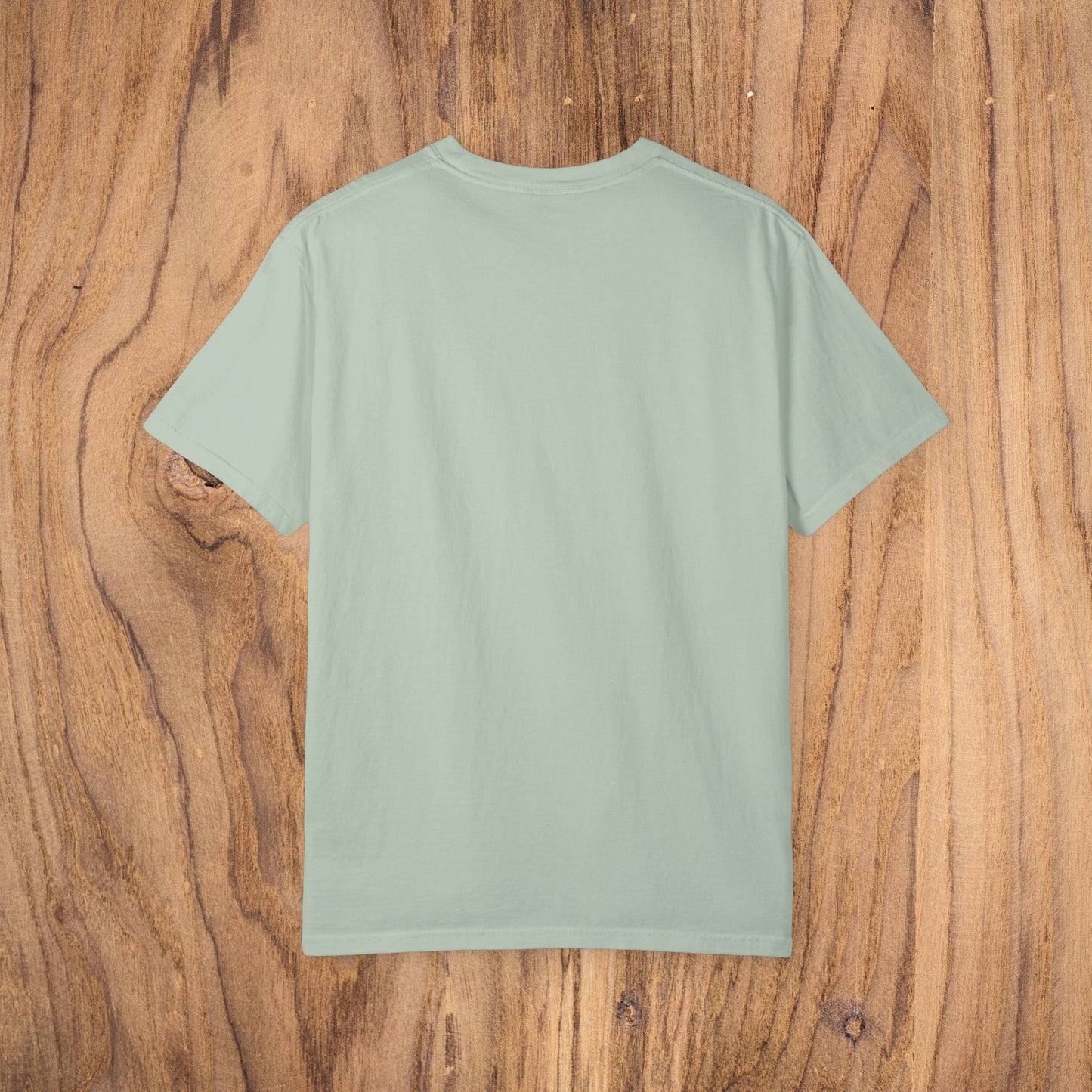 Back view of Unisex Sunset Palm Tree T-Shirt in mint green. A vibrant garment-dyed cotton tee for men and women, ideal for casual wear, available in 58 colors.