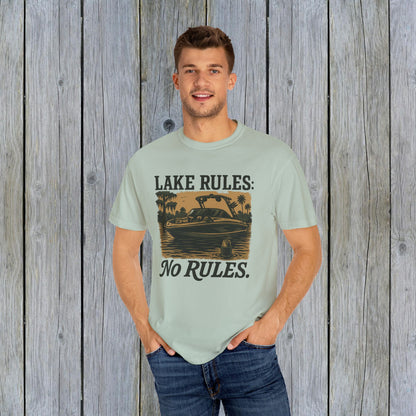 Man wearing Unisex Garment-Dyed Lake Rules Tee, standing confidently in a casual setting with a lake-inspired design, perfect for adventure seekers.