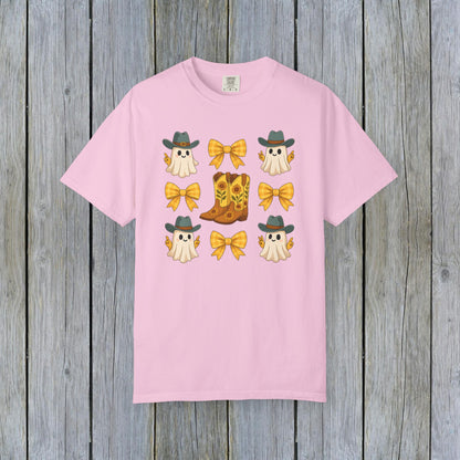Cute Halloween T-Shirt featuring playful ghosts and cowboy boots, perfect for unisex fall fashion. Made from eco-friendly fabric, ideal for spooky season celebrations.