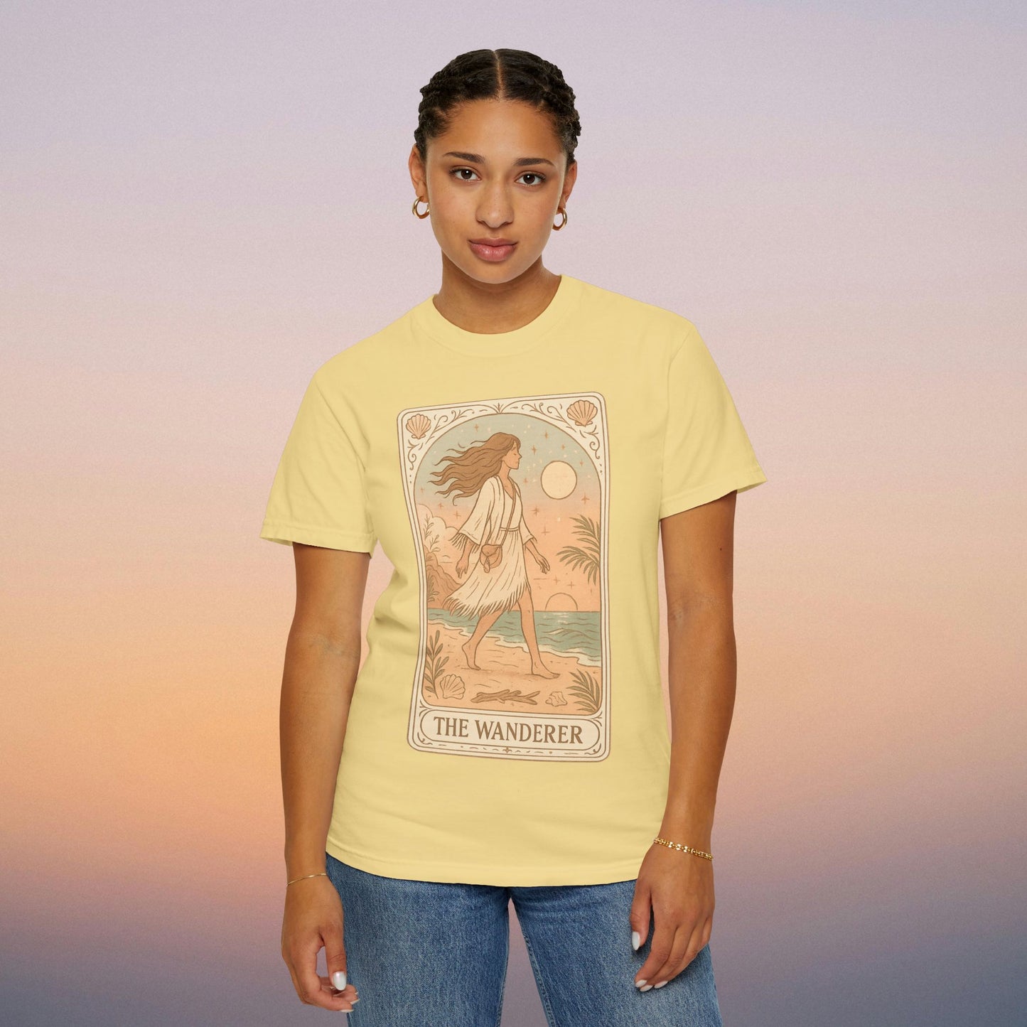 Wanderer Tarot Graphic Tee in soft yellow, featuring a beautiful illustration of The Wanderer. Ethically made from 100% cotton, available in sizes S to 4XL, offering unique style and comfort.