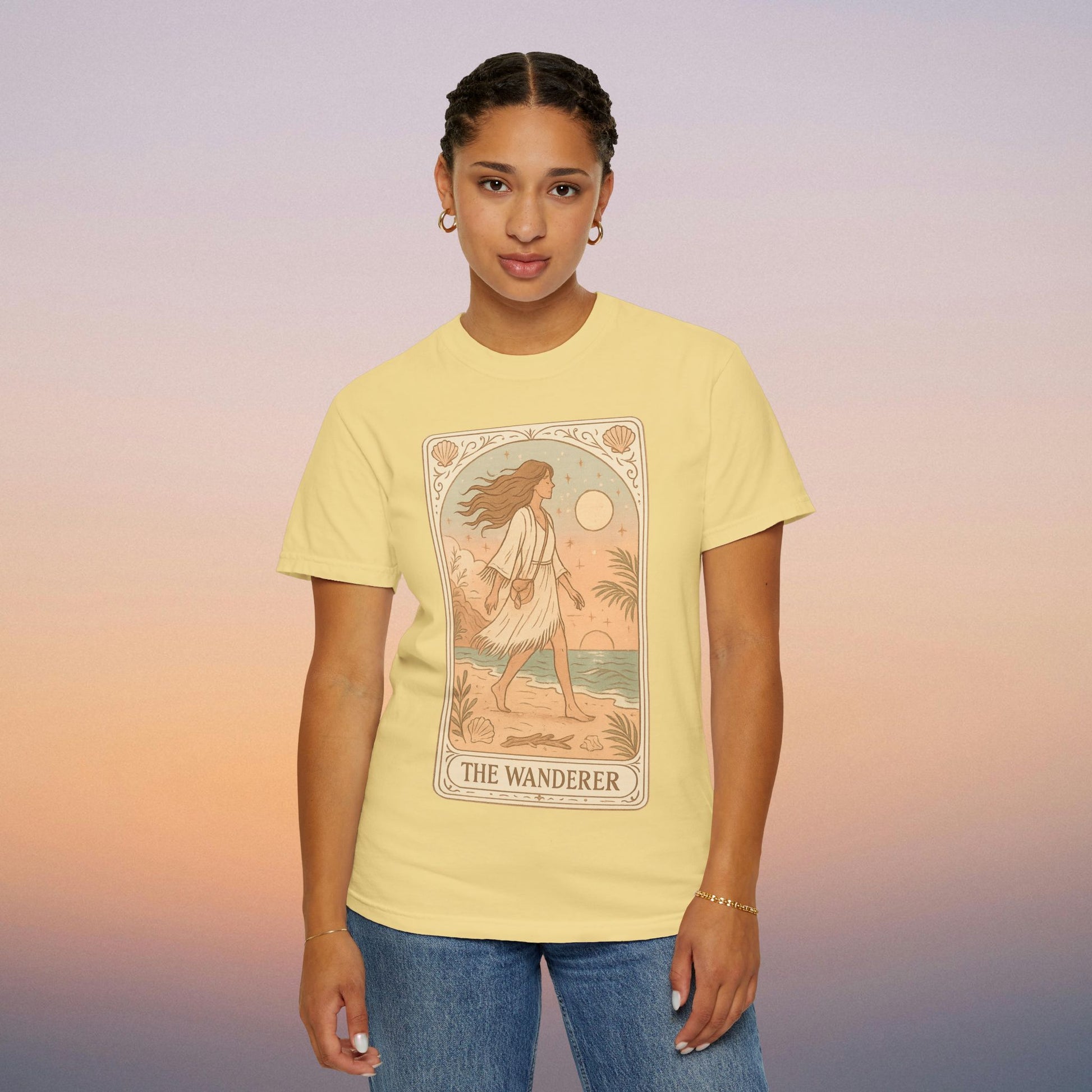Wanderer Tarot Graphic Tee in soft yellow, featuring a beautiful illustration of The Wanderer. Ethically made from 100% cotton, available in sizes S to 4XL, offering unique style and comfort.