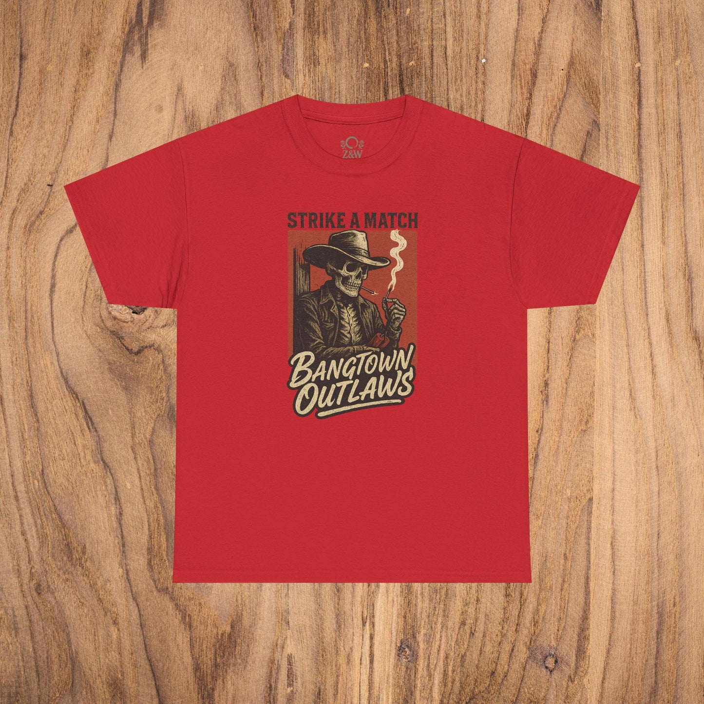 Bangtown Outlaws Retro Casual Party Shirt in bold red color featuring a retro-inspired graphic of a skeleton holding a cigarette with the phrase 'Strike a Match'. This unisex cotton tee is perfect for stylish gifting and casual parties.