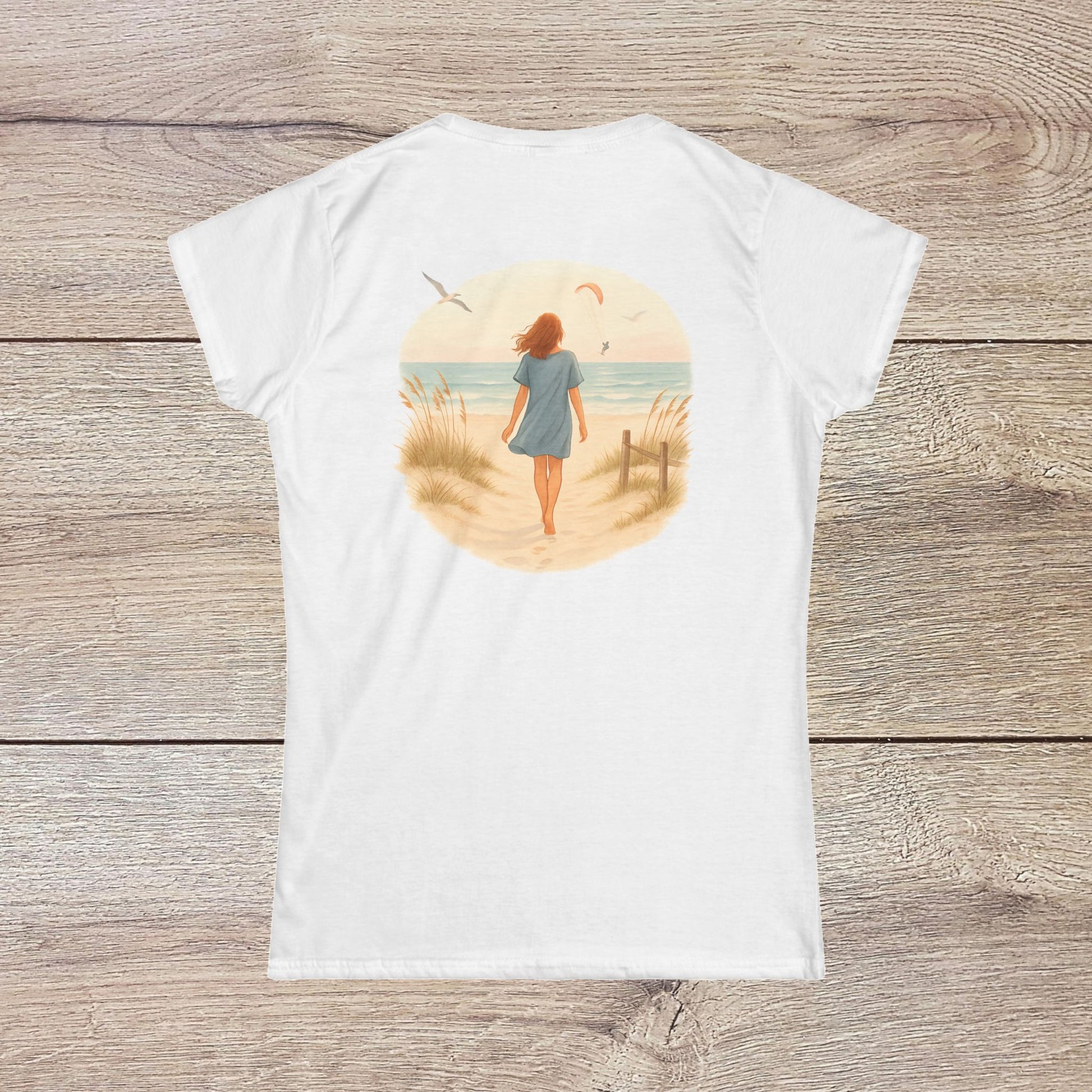 Back view of Women's Coastal Spirit Midweight Cotton Tee in white - Soft, breathable, semi-fitted beachwear with a serene ocean print, perfect for beach lovers.