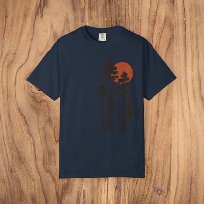 Sunset Trees Unisex T-Shirt in navy blue, featuring a serene graphic design of trees against a red sunset, made from soft 100% cotton, perfect for casual and semi-formal wear.