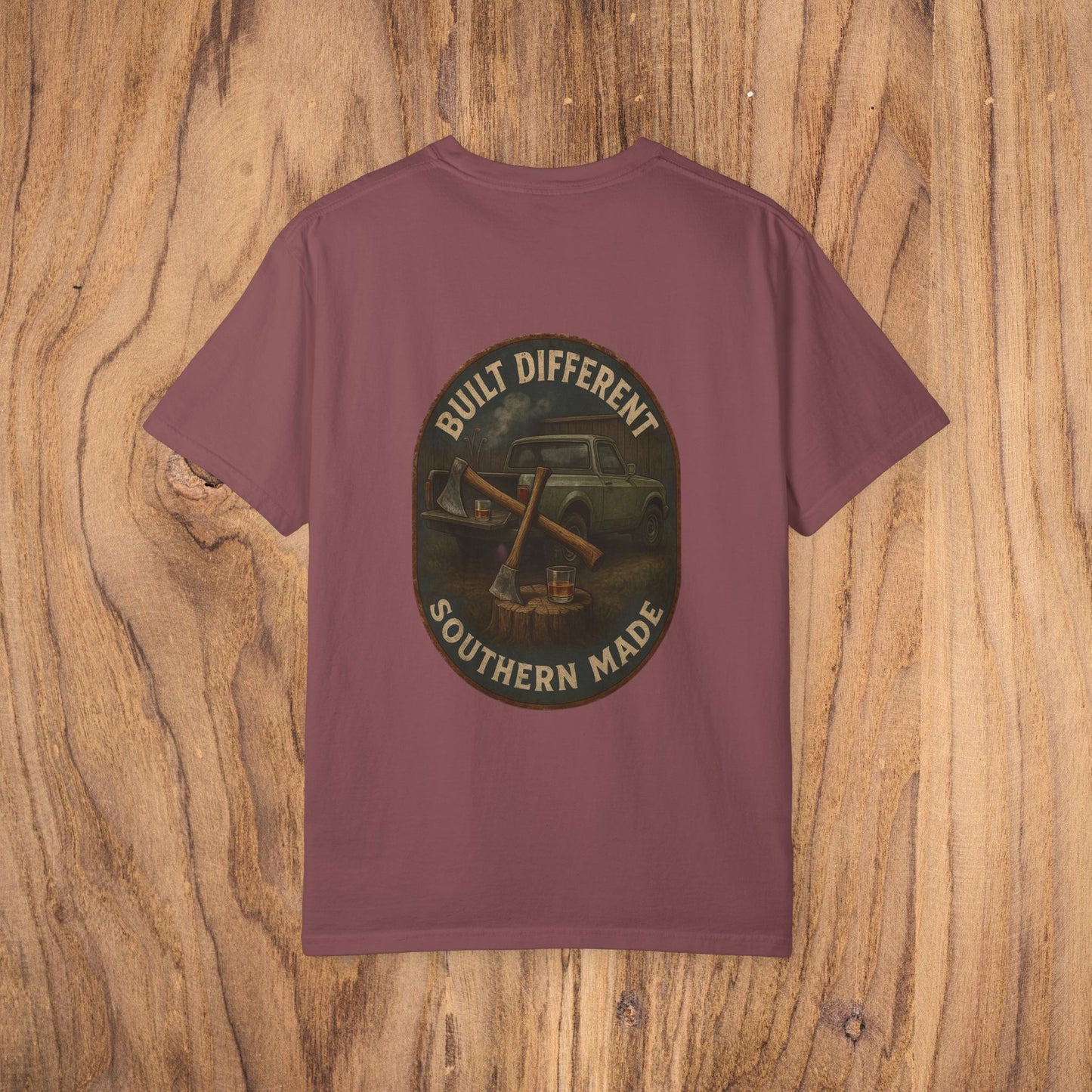 The back view of a Premium Southern Made T-Shirt featuring the slogan 'BUILT DIFFERENT SOUTHERN MADE' on a maroon shirt.