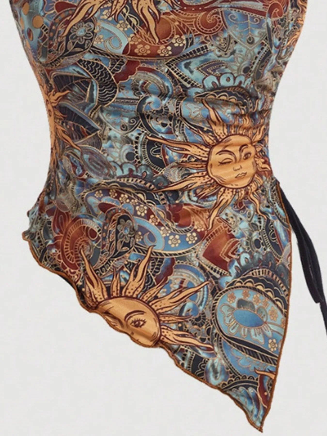 Close-up of the Trendsi Asymmetrical Drawstring Printed Tube Top showcasing intricate sun motifs, perfect for stylish women's wear. Ruched and slightly stretchy for a flattering fit.
