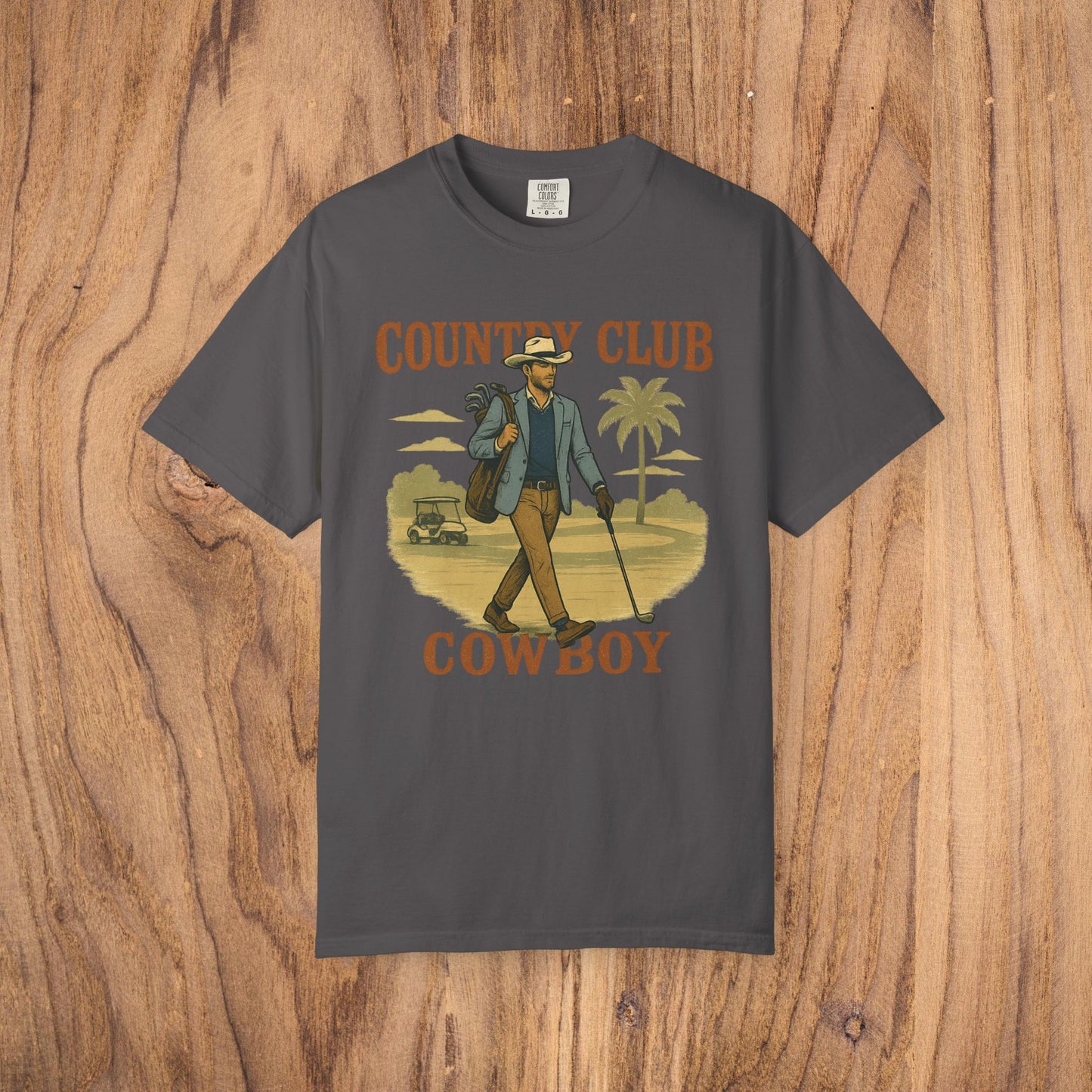 Country Club Cowboy Graphic Tee in charcoal gray, depicting a fashionable cowboy with a golf bag, excellent for outdoor adventures.