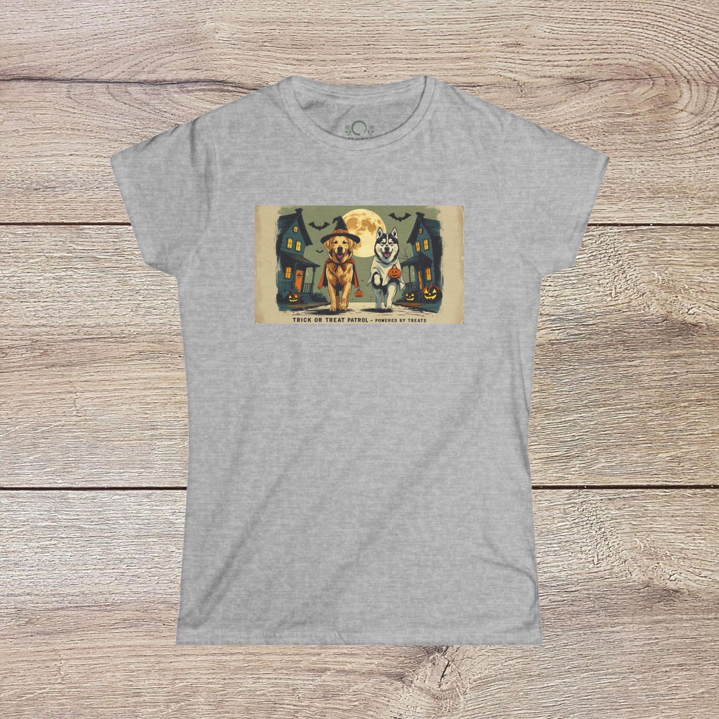 Unisex Softstyle Trick Or Treat T-Shirt featuring two dogs in costumes against a Halloween backdrop, made of 100% ring-spun cotton, ideal for casual wear.