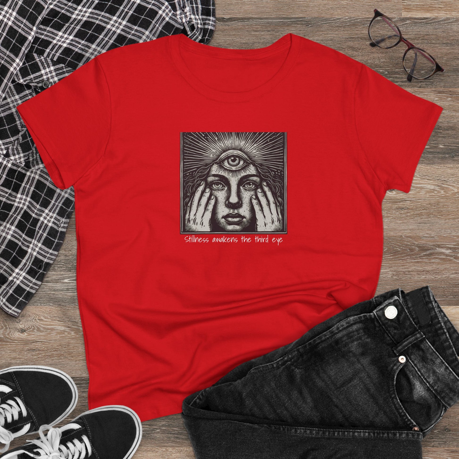 Fashionable display of the Stylish Third Eye Graphic Tee laid flat with black jeans and sneakers, highlighting its trendy cropped fit and striking red color.