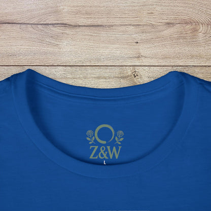 Wildflowers T-Shirt with a ribbed collar displayed on a wooden surface, showcasing its unique logo on the back and smooth fabric texture.