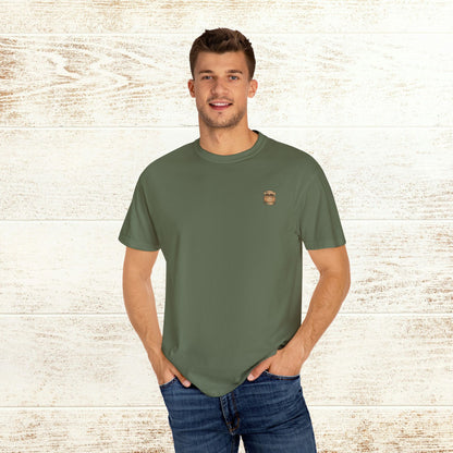 Model showcasing the green Rodeo On The Rocks Tee, emphasizing its comfortable fit and unique cotton material.
