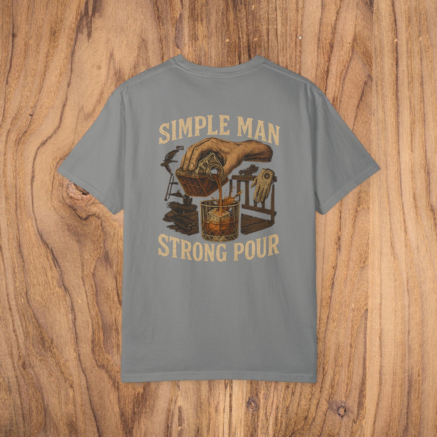 Simple Man Strong Pour T-Shirt in gray featuring a detailed illustration of a hand pouring a drink, perfect for casual wear and made from 100% cotton.