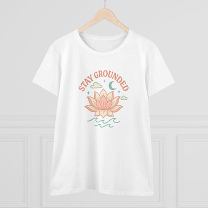 Stay Grounded Spiritual Tee displayed on a hanger, featuring a beautiful lotus illustration on a classic white crop top, ideal for warm days.