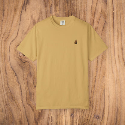Premium Southern Made T-Shirt highlighted in a warm mustard color displayed on a wooden background, a great choice for stylish casual wear.