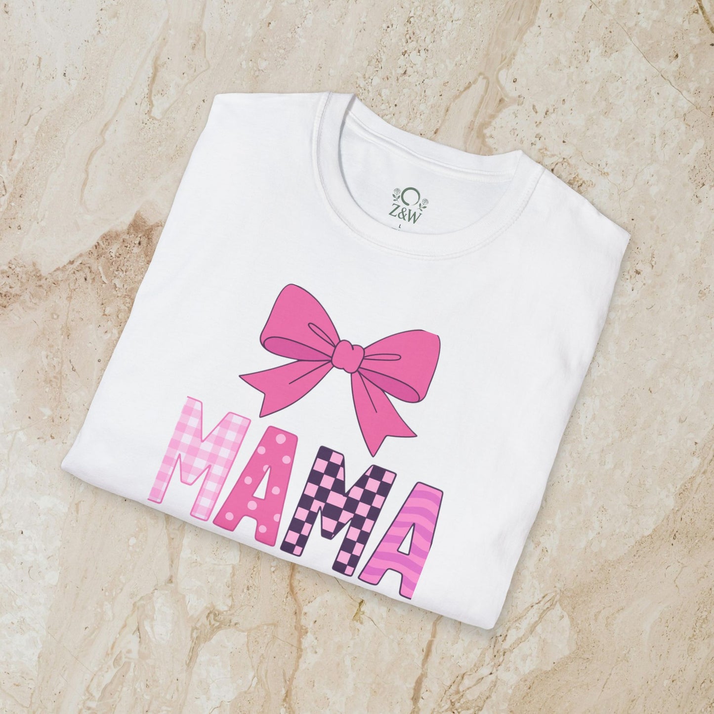 Mama Bow Tee - Seamless 100% Cotton T-Shirt folded neatly, displaying a charming bow and vibrant 'MAMA' design, offering a blend of comfort and style.