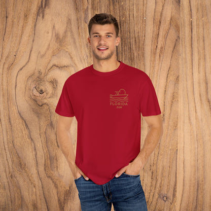 Unisex Florida Graphic Tee worn by a model in vibrant red, highlighting the stylish boat design for relaxed everyday wear.