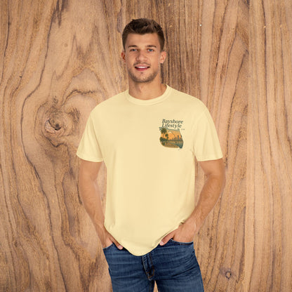 Bayshore Lifestyle Tee featuring a vibrant design on a light yellow shirt, showcasing lightweight 100% cotton fabric with a ribbed neck, suitable for all seasons.