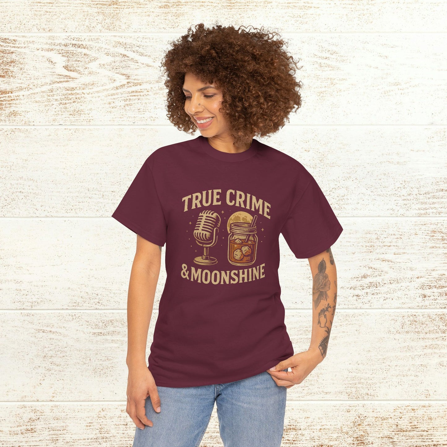 True Crime & Moonshine Unisex Graphic Tee - Vintage Casual Wear for True Crime Lovers, modeled by a person, highlighting the fun design featuring a microphone and moonshine jar in a cozy setting.