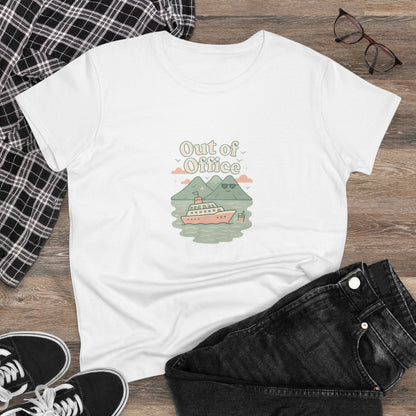 Out Of Office Cruise Tee illustrated with a cruise ship and mountains, laid on a wooden surface with stylish black jeans and sneakers, showcasing a soft cotton blend and lightweight design perfect for warm weather.