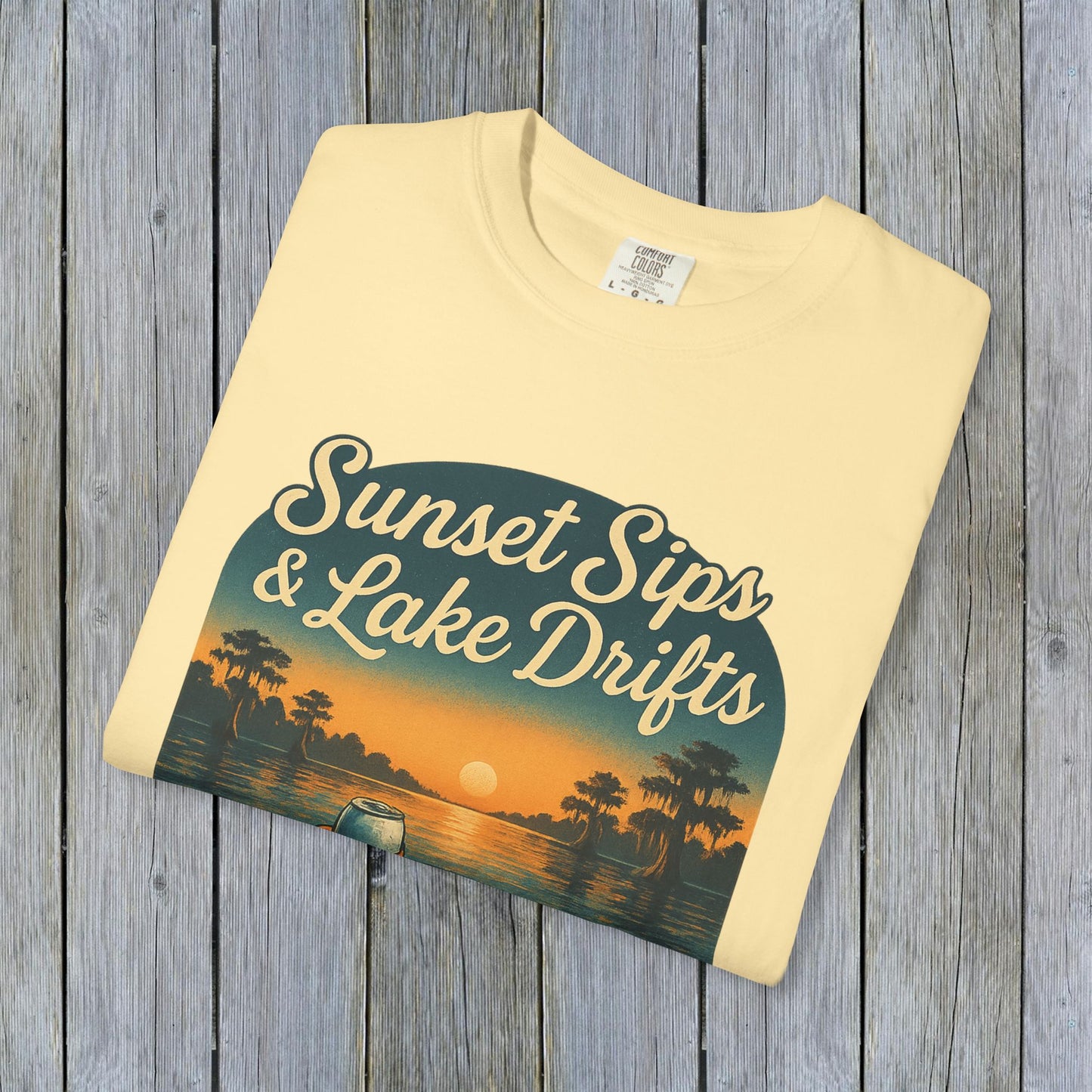 Lake Drifts T-Shirt in soft yellow with 'Sunset Sips & Lake Drifts' graphic, perfect for casual wear.