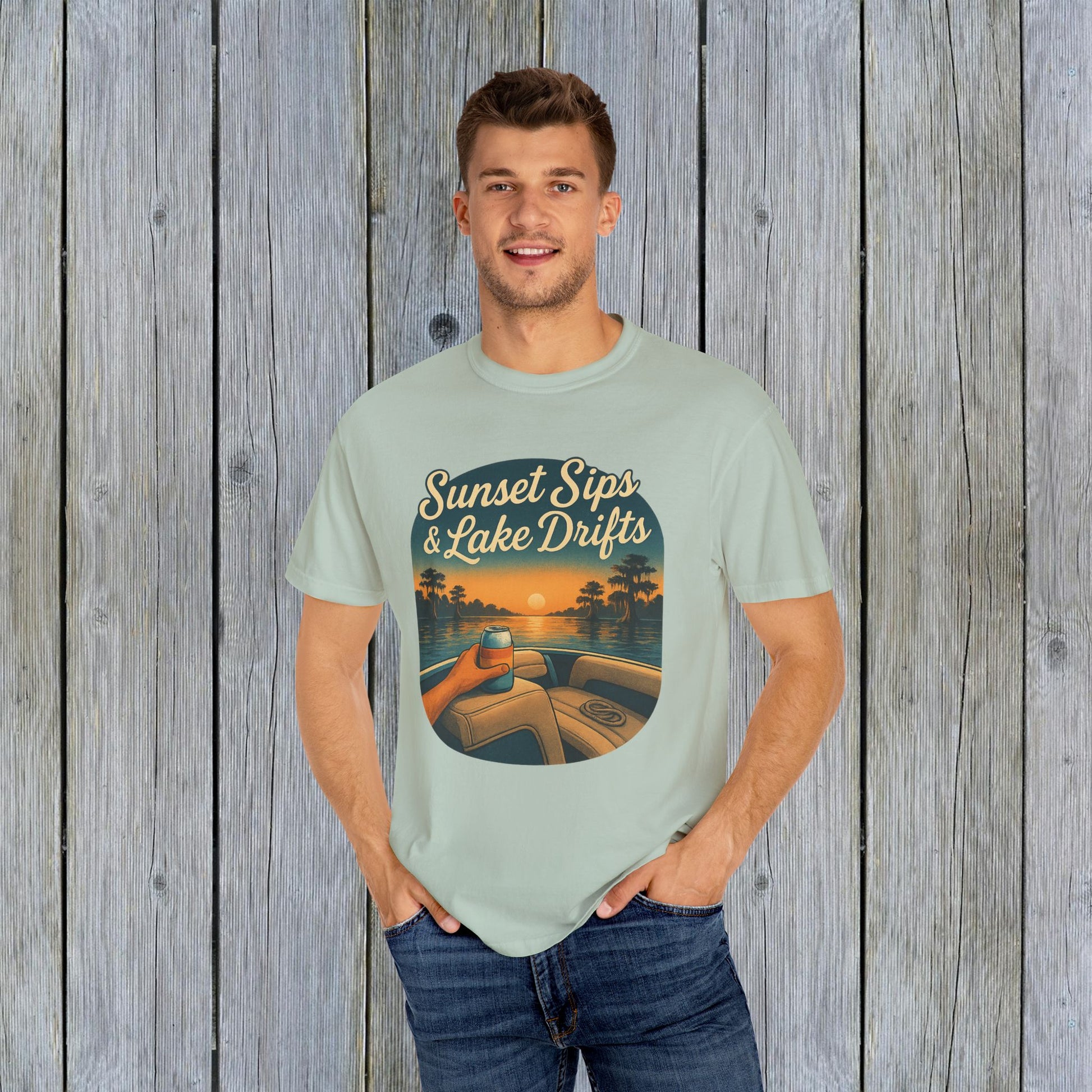 Model in a light green Lake Drifts T-Shirt, featuring 'Sunset Sips & Lake Drifts' print, perfect for relaxed summer style.