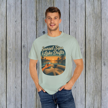 Model in a light green Lake Drifts T-Shirt, featuring 'Sunset Sips & Lake Drifts' print, perfect for relaxed summer style.