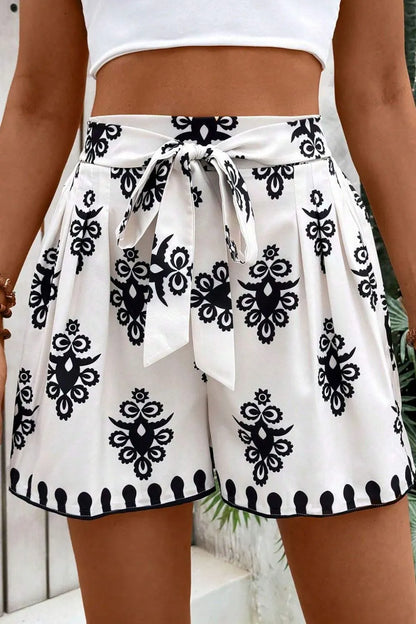 Stylish Tied Printed Shorts featuring a unique black and white pattern, perfect for summer outfits. Ideal for casual wear and made of lightweight polyester.