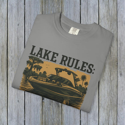Front view of the Unisex Garment-Dyed Lake Rules Tee, featuring a vibrant graphic with a boat and the text 'Lake Rules' on a gray fabric.