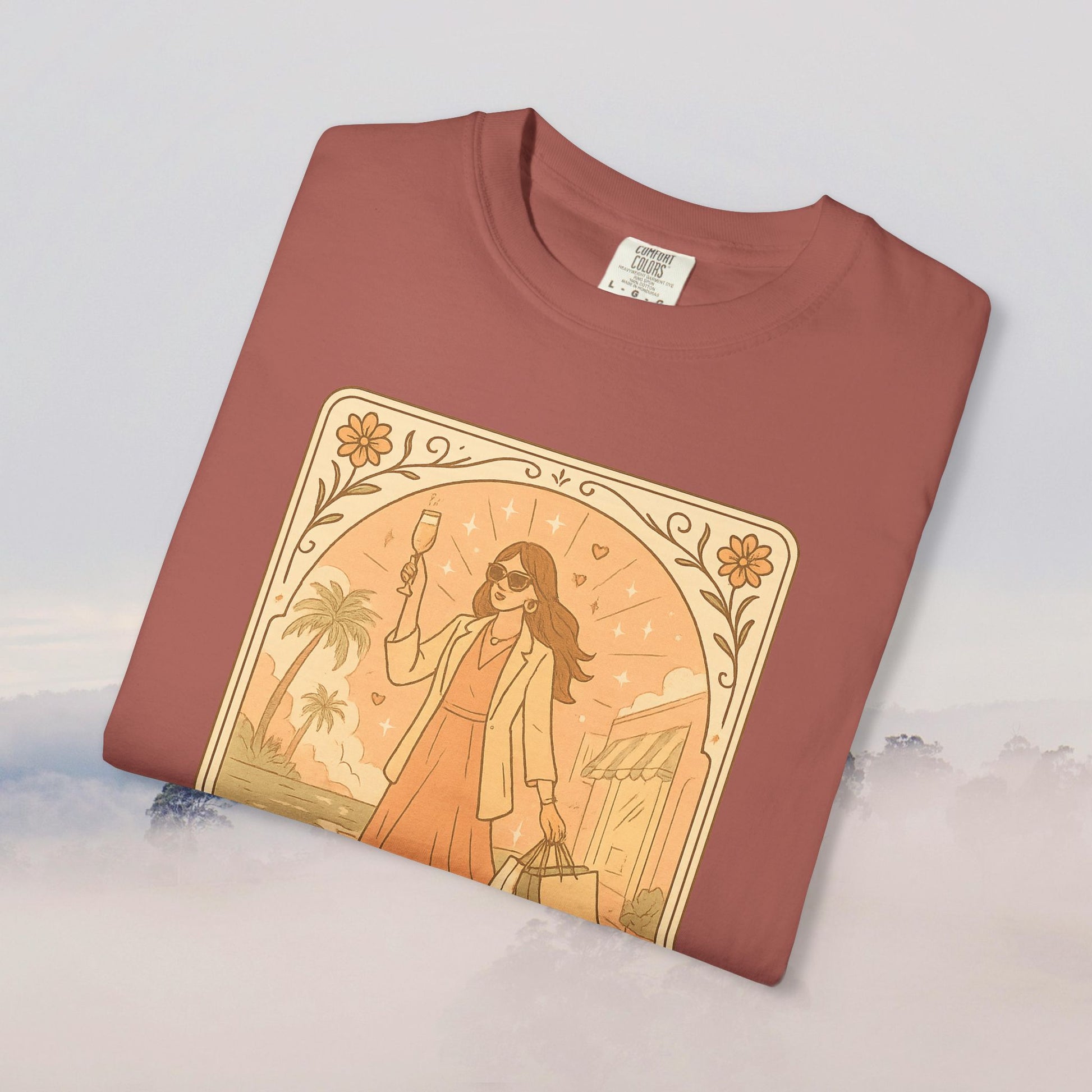 Brunch Babe Tarot Graphic Tee featuring a stylish illustration of a woman with sunglasses and a drink, in a chic rust color, perfect for casual style, made from 100% cotton.