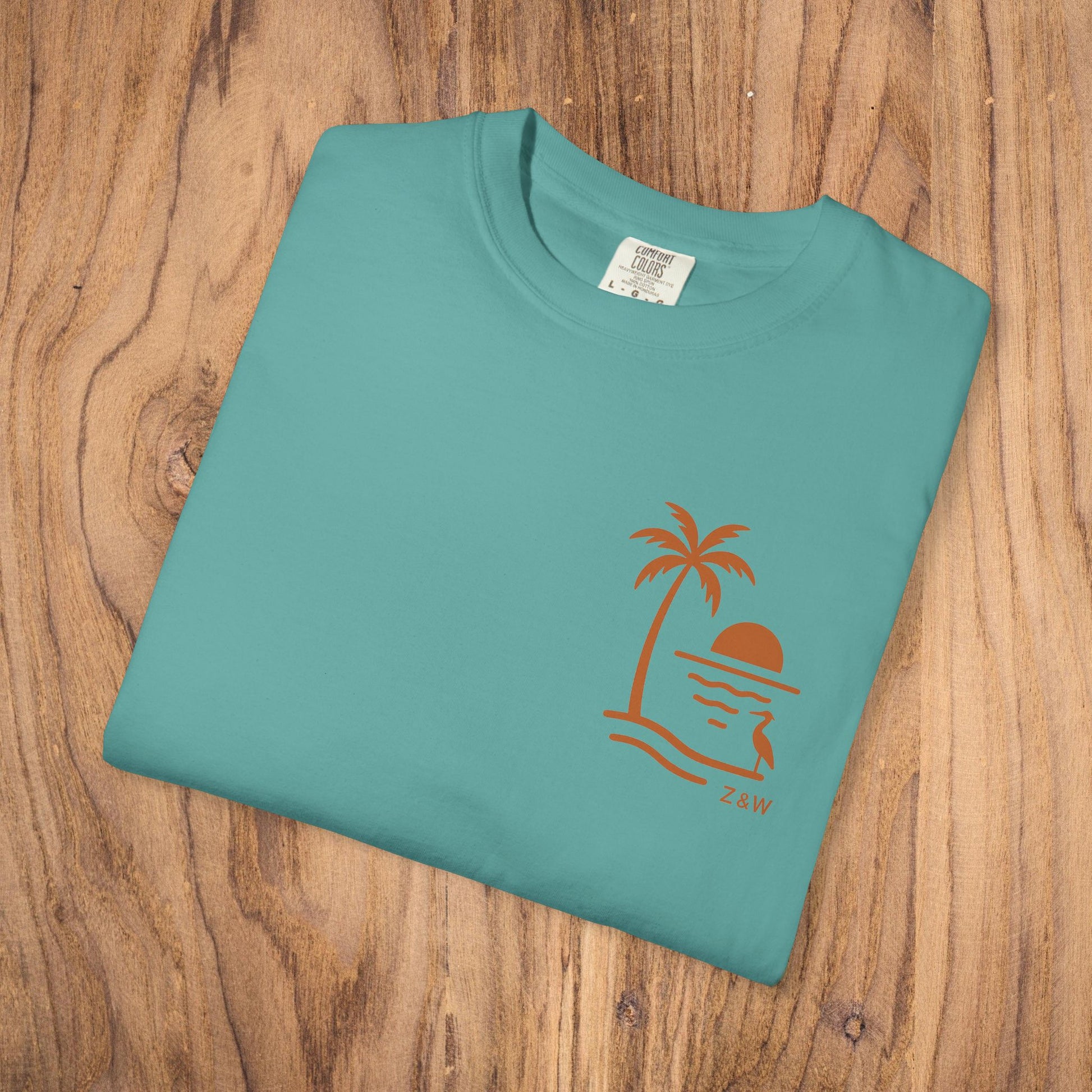 Unisex Sunset Palm Tree T-Shirt - Front view of a stylish turquoise tee featuring a palm tree sunset design, perfect for all genders.